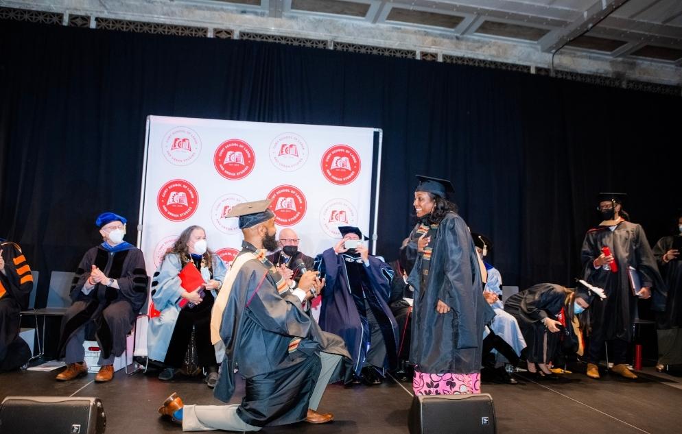 M.A. in Labor Studies student Nicolas Pineda proposes to his partner Noelle Hill.